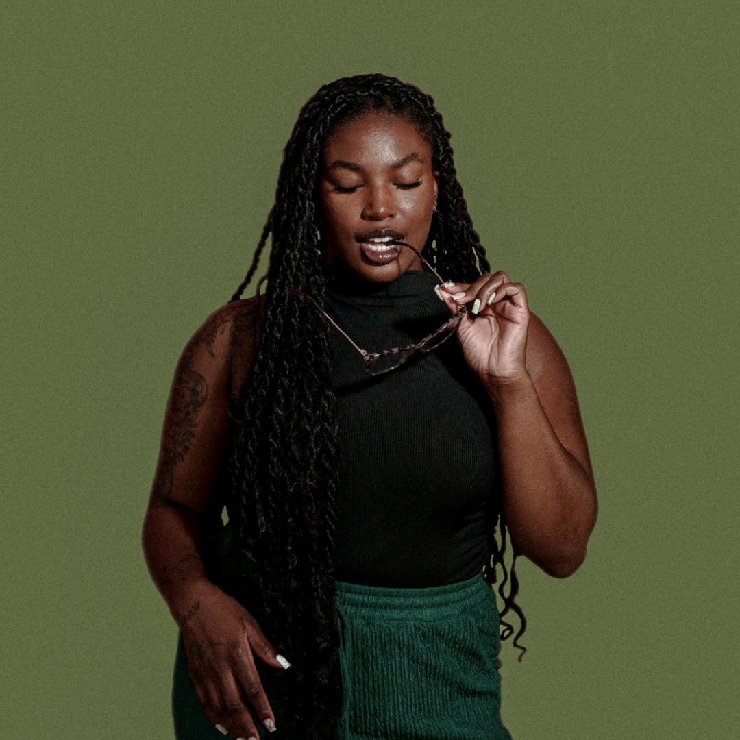 Portrait of Dani holding necklace